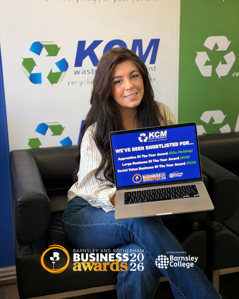 Ellie Hickling holding a laptop showing KCM Waste Management’s Barnsley & Rotherham Business Awards shortlist announcement